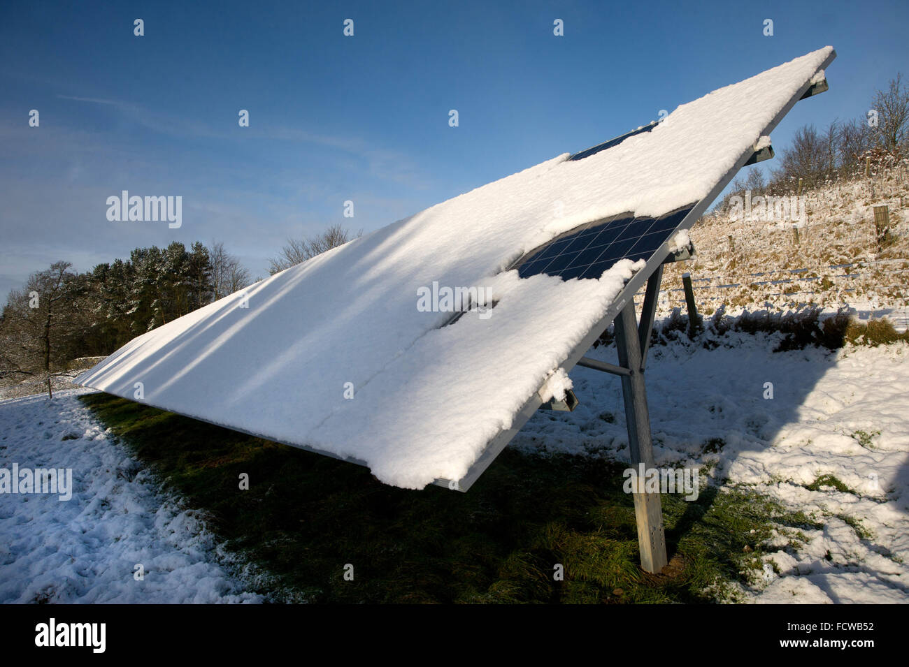 Snow covered solar panels, Northumberland Stock Photo Alamy