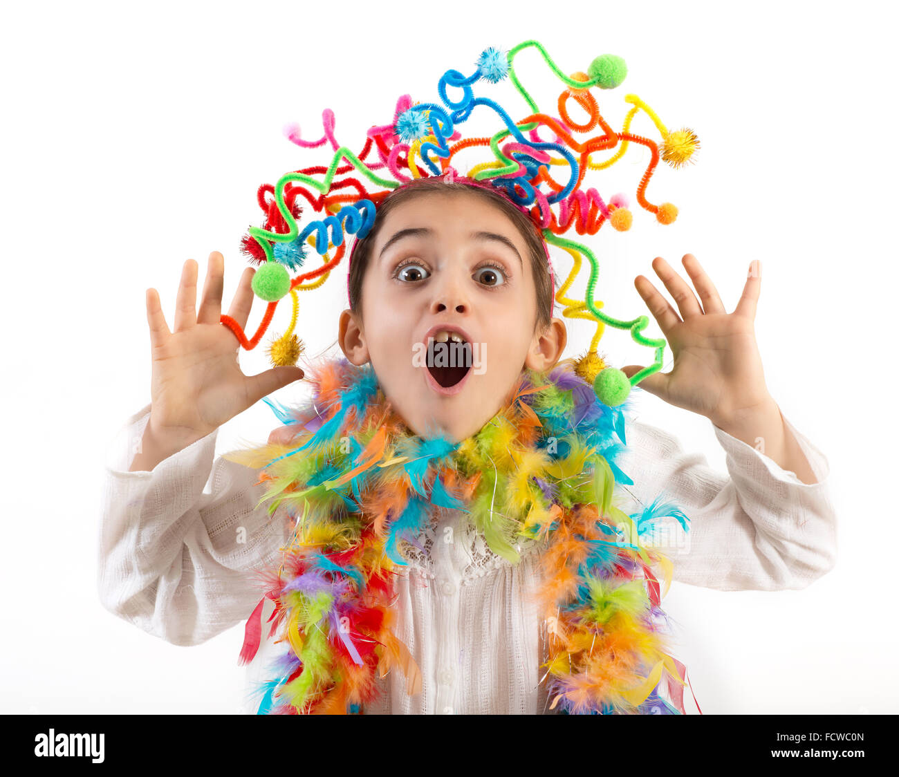 Little party girl having fun laughing and waving her hands excitedly at the camera Stock Photo