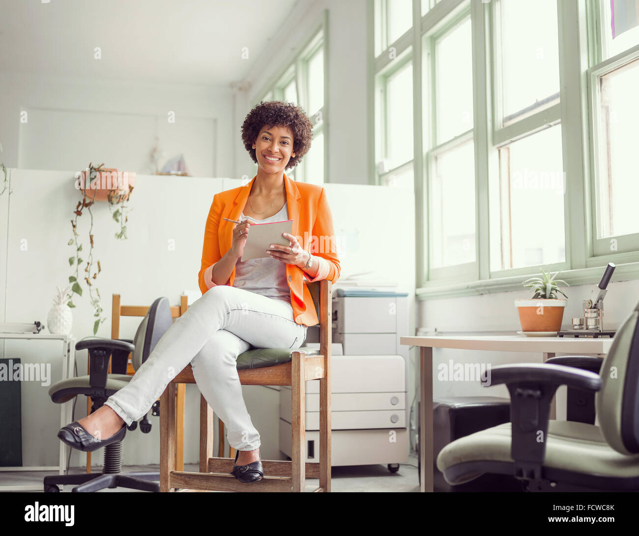 Portrait of young businesswoman in office Stock Photo - Alamy