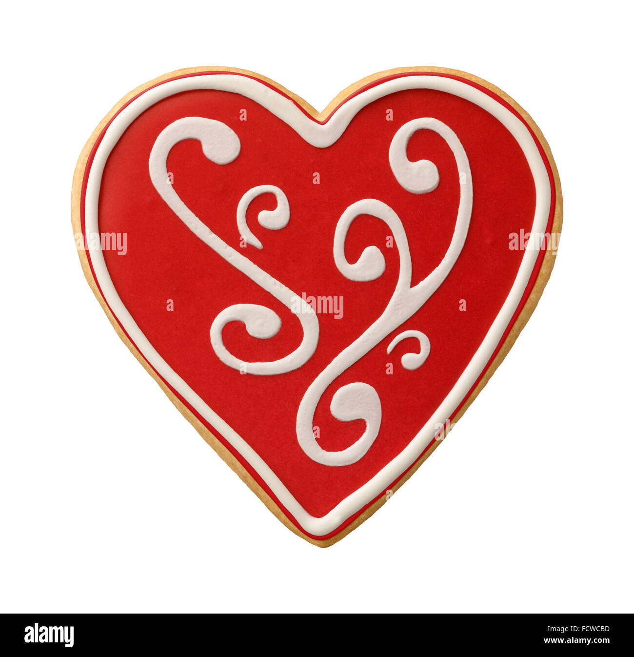 Heart Shaped Valentine Cookie isolated, with scroll work icing. Stock Photo