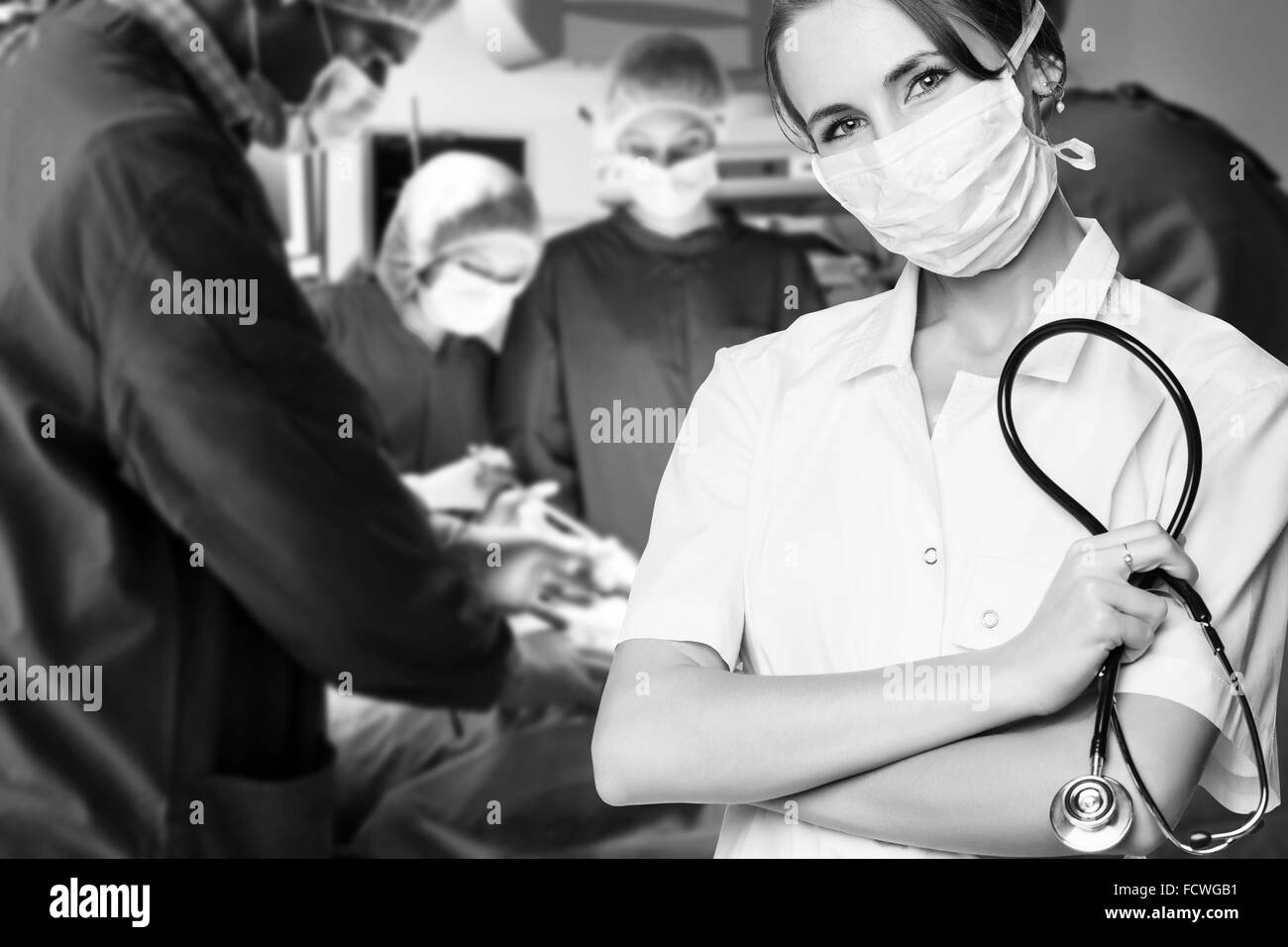 Surgery team operating in a surgical room Stock Photo