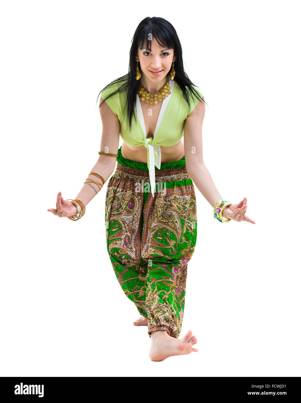 full length portrait of indian woman dancing in studio.  Isolated on white Stock Photo