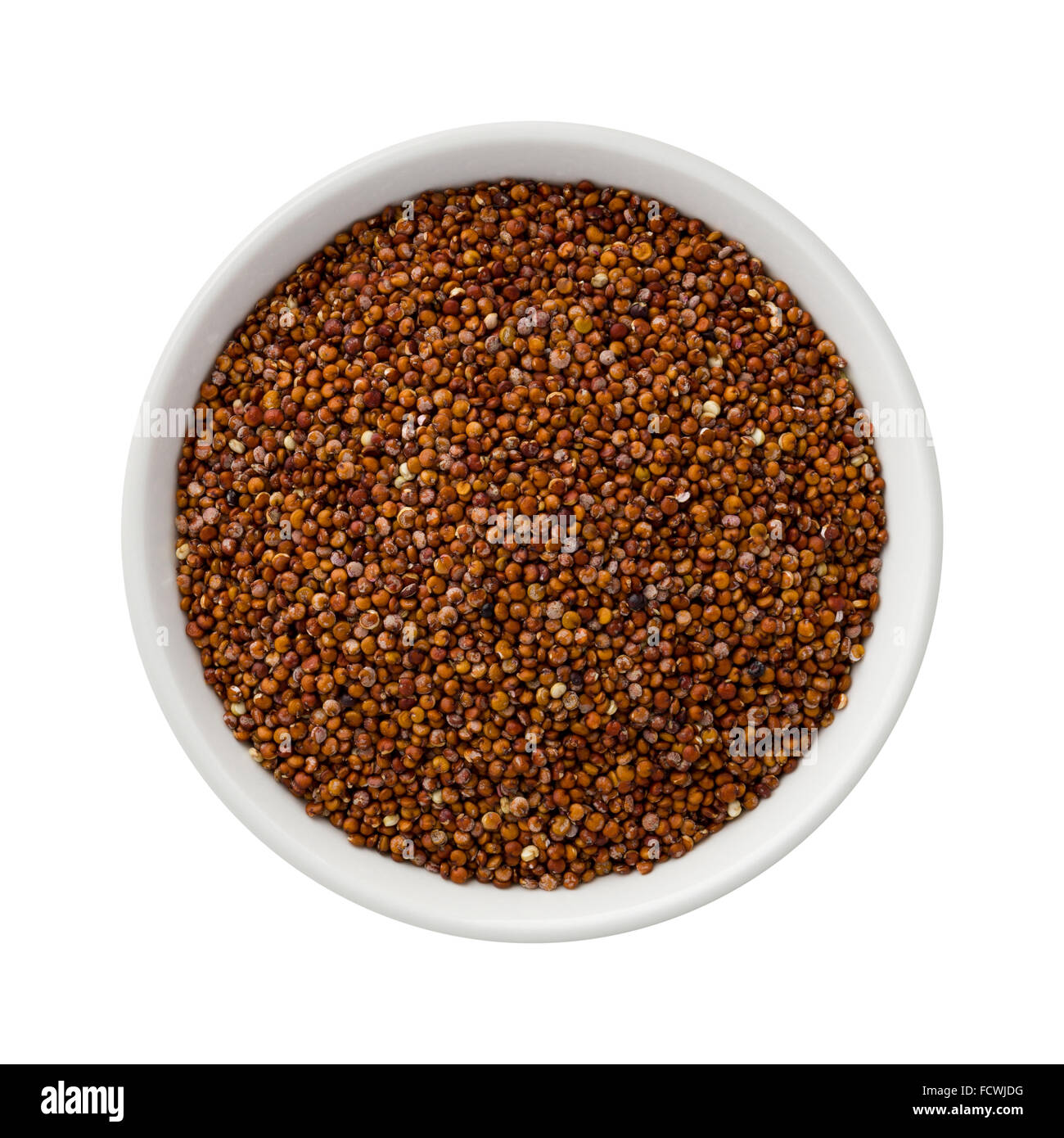 Royal Red Quinoa in a white ceramic bowl. The image is a cut out, isolated on a white background. Stock Photo