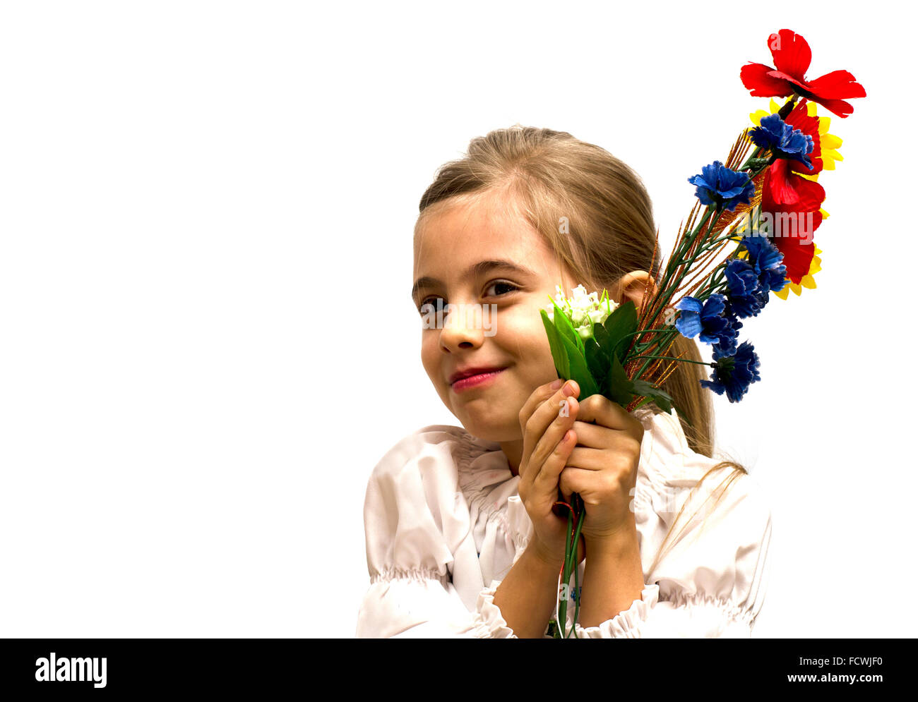 smiling little girl with a bouquet of flowers Stock Photo - Alamy