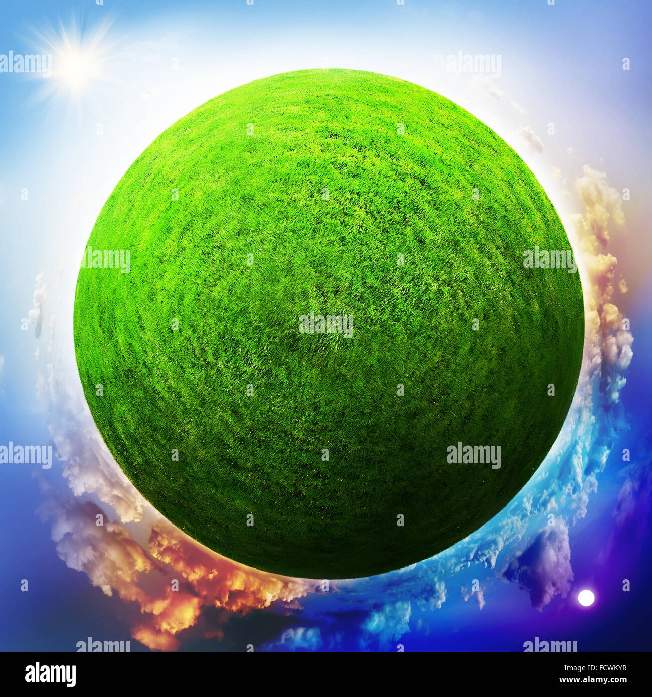 Globe with grass with the change of day and night Stock Photo