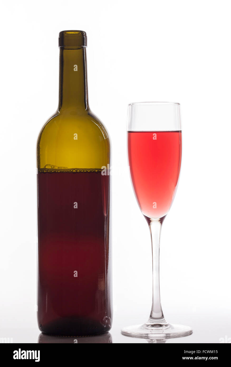 glass of pink wine and bottle on white background Stock Photo Alamy