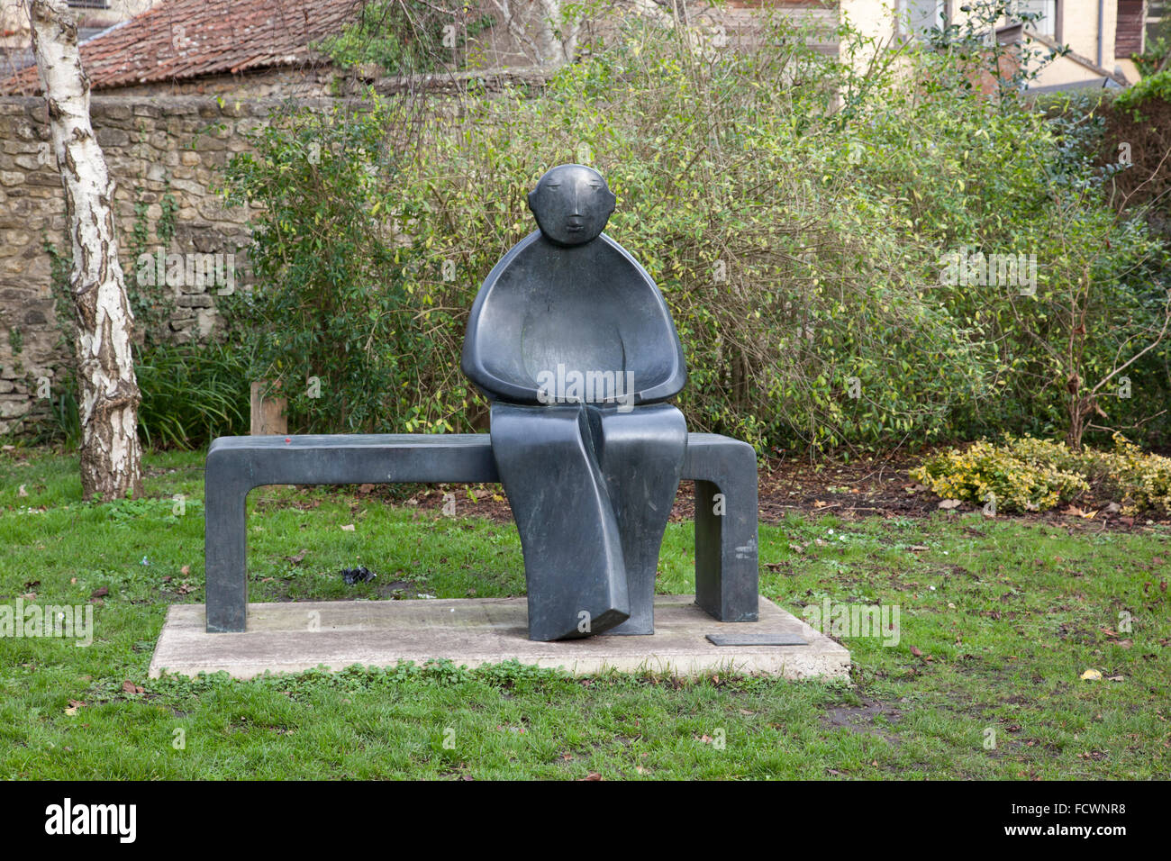Man on a Bench, bronze sculpture by Giles Penny, Bruton, Somerset