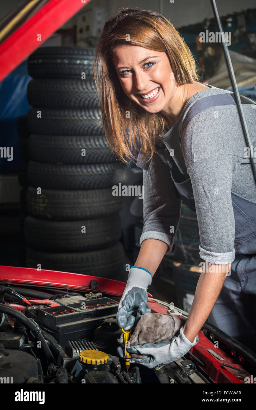 Lovely female car mechanic in auto repair service Stock Photo