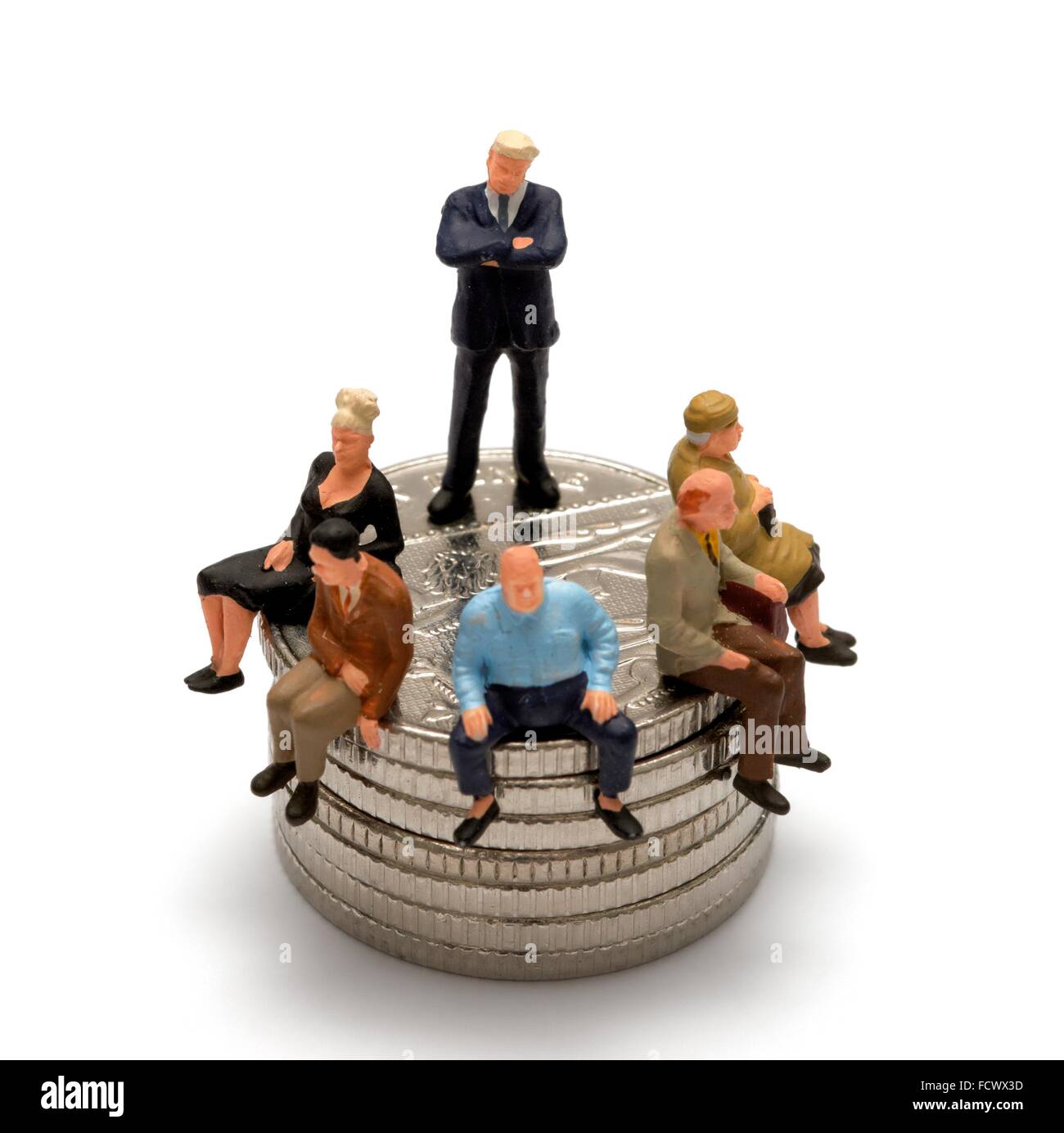A miniature figurine man posing as a bank manager standing on some coins  with people sitting down Stock Photo - Alamy
