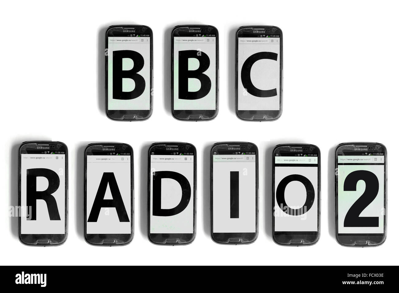 BBC Radio2 written on the screens of smartphone photographed against a white background. Stock Photo