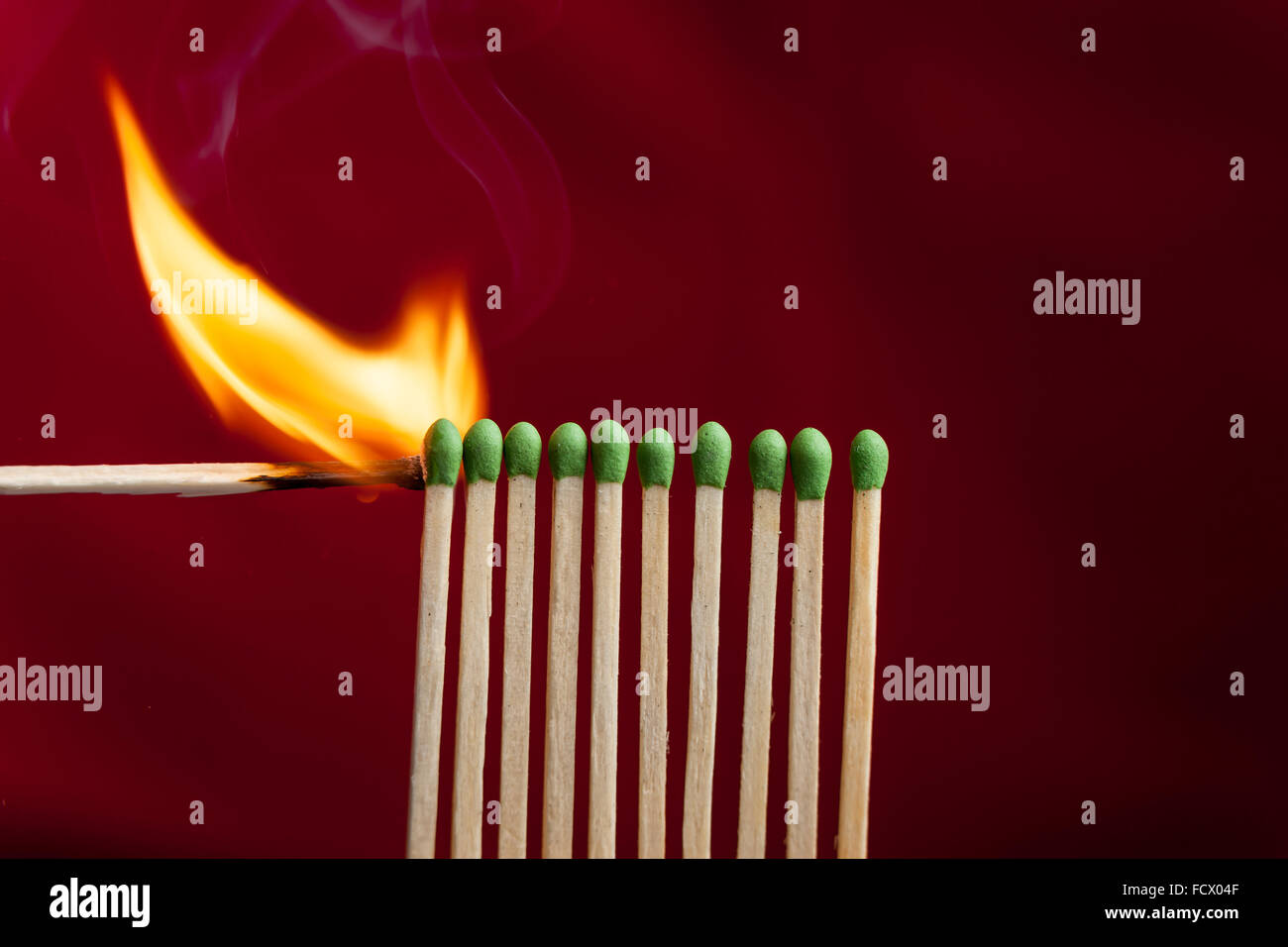 Lighting matches in a row Stock Photo Alamy