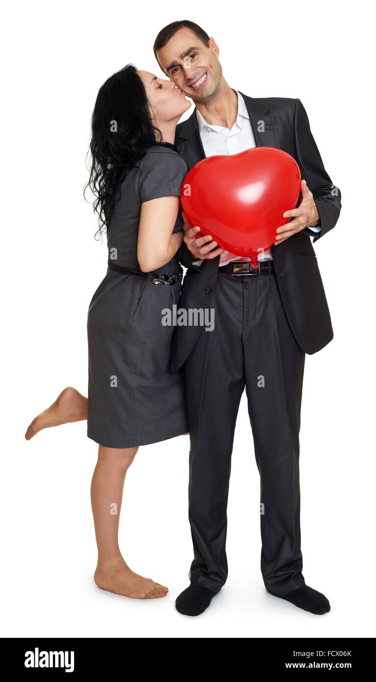 Happy couple kissing portrait. Man hold red heart shaped balloon ...