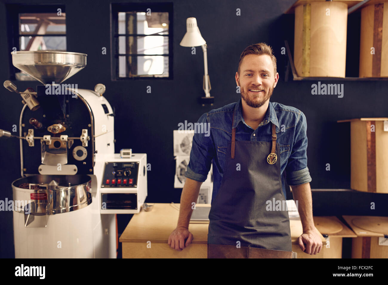 Entrepreneur in his modern coffee roastrery and distribution spa Stock Photo