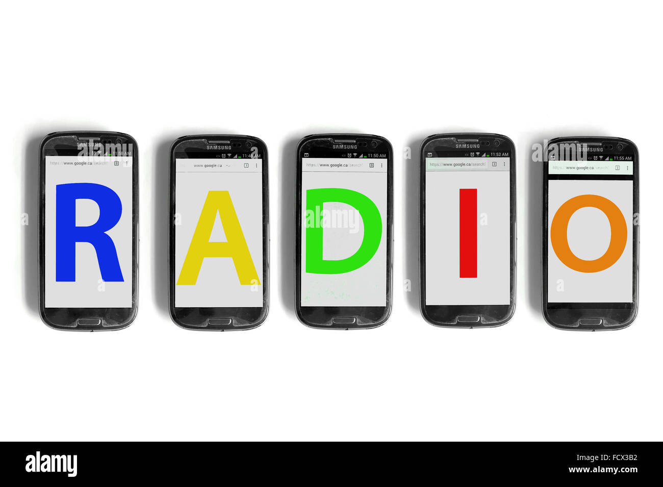 Radio on the screens of smartphones photographed against a white background. Stock Photo
