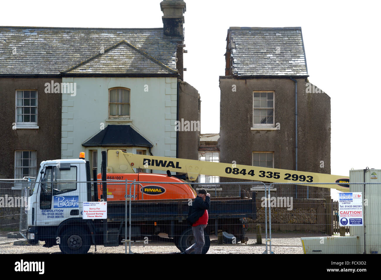 Demolition of Coastguard cottage at Birlng Gap, East Sussex, UK after winter storms eroded the chalk cliffs causing collapse Stock Photo