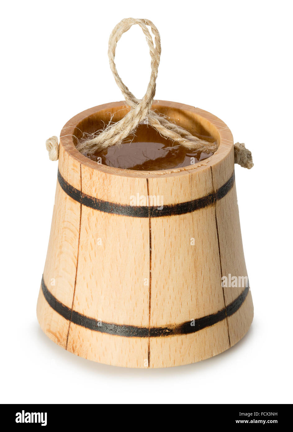 wooden bucket with water isolated on the white background. Stock Photo