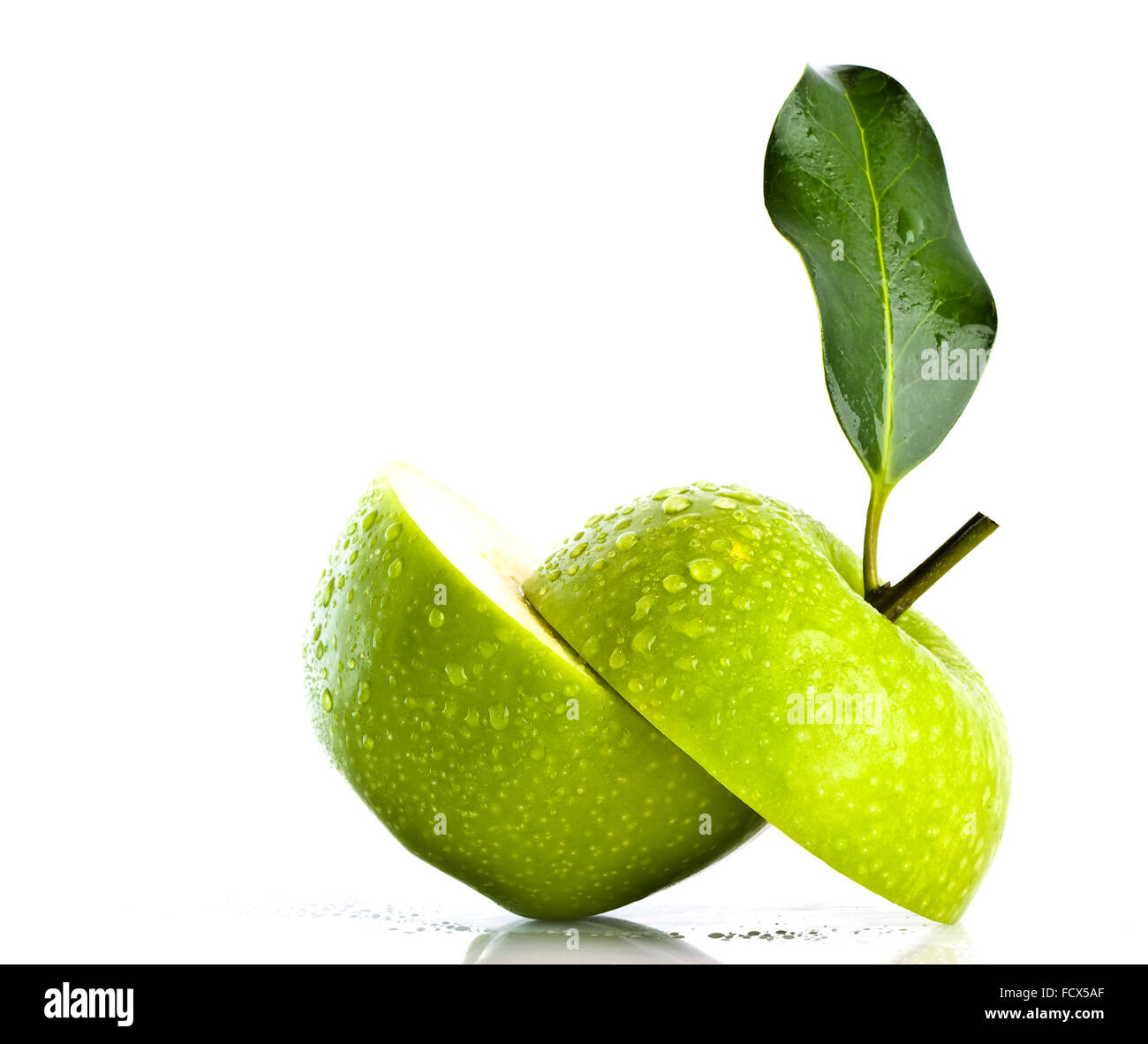 Two green apple halfs over white background Stock Photo