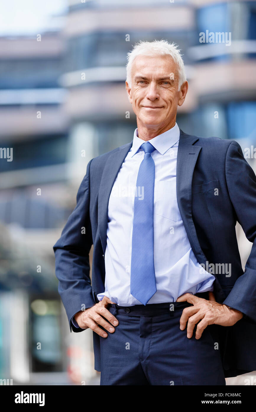 Portrait of confident businessman in suit outdoors Stock Photo - Alamy