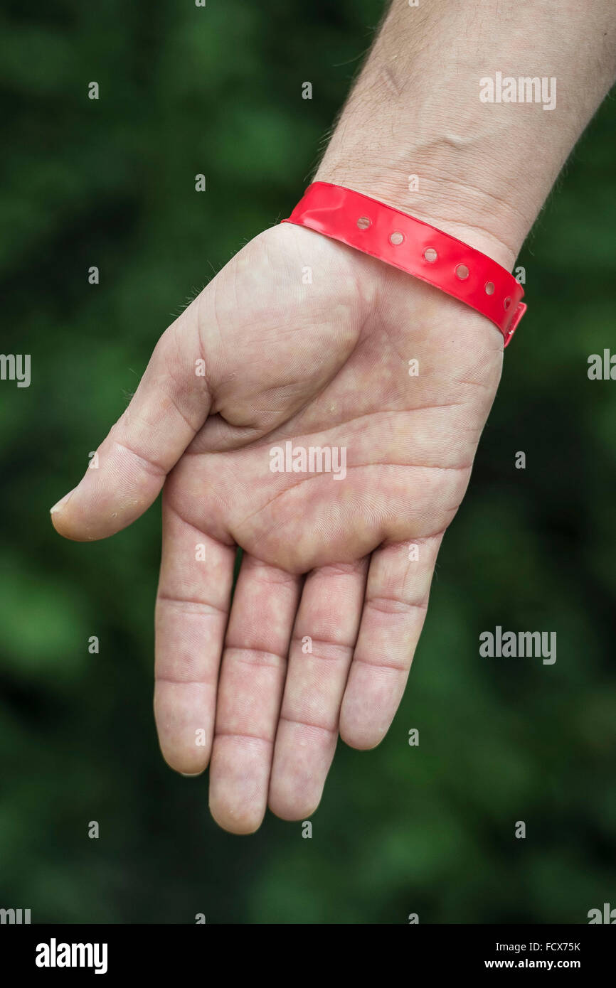 Asylum seekers at Lynx House in Cardiff, South Wales, were made to wear red wrist bands in order to claim food. Stock Photo