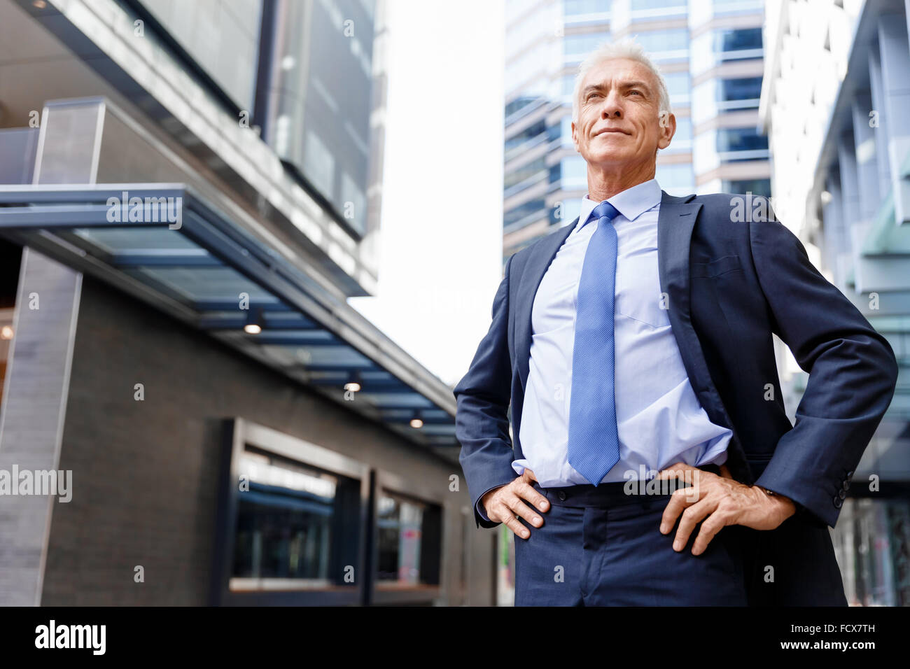 Portrait of confident businessman in suit outdoors Stock Photo - Alamy