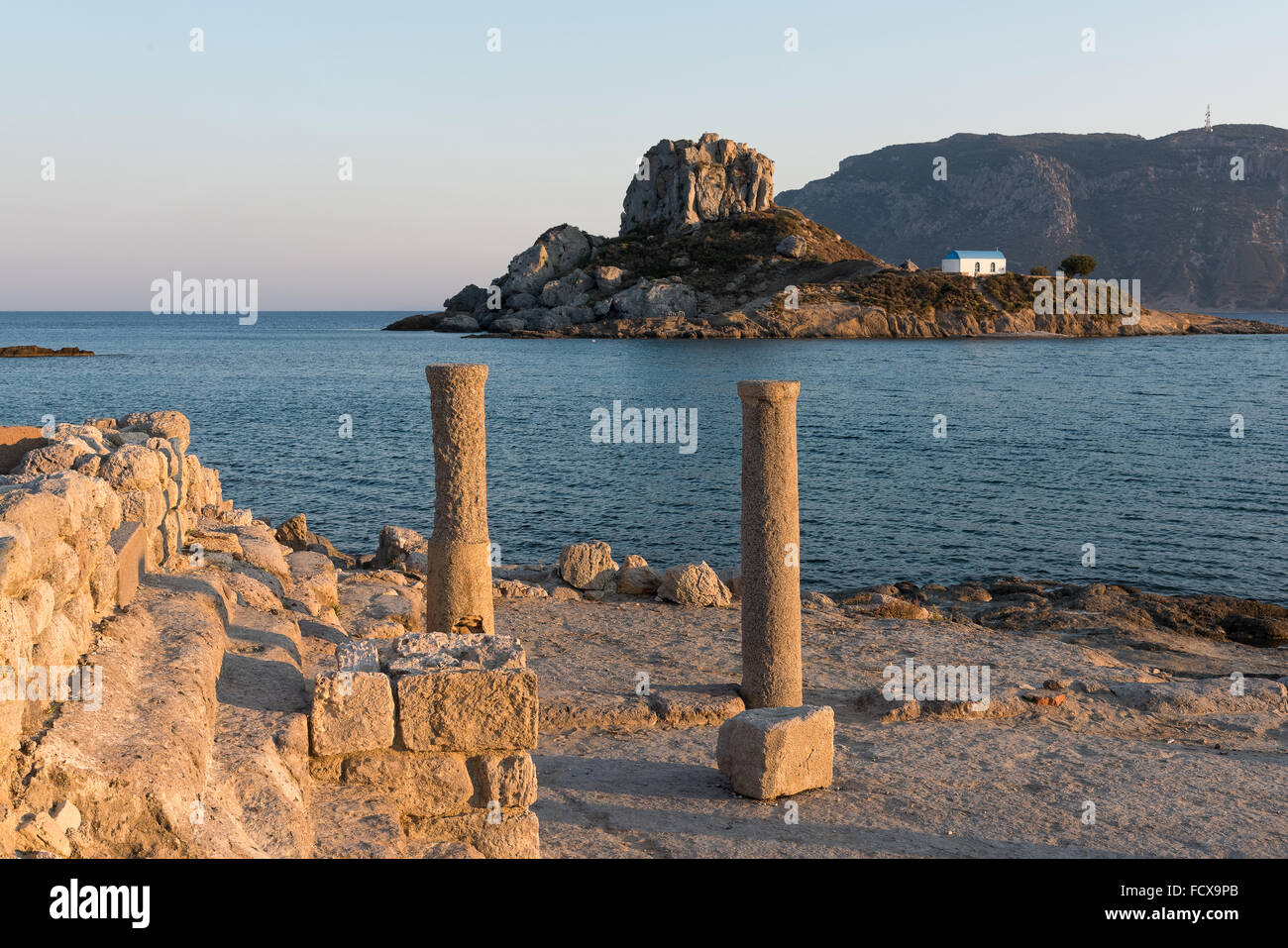 Landscape with archaeological site and islet at sunset in Kos island, Greece Stock Photo