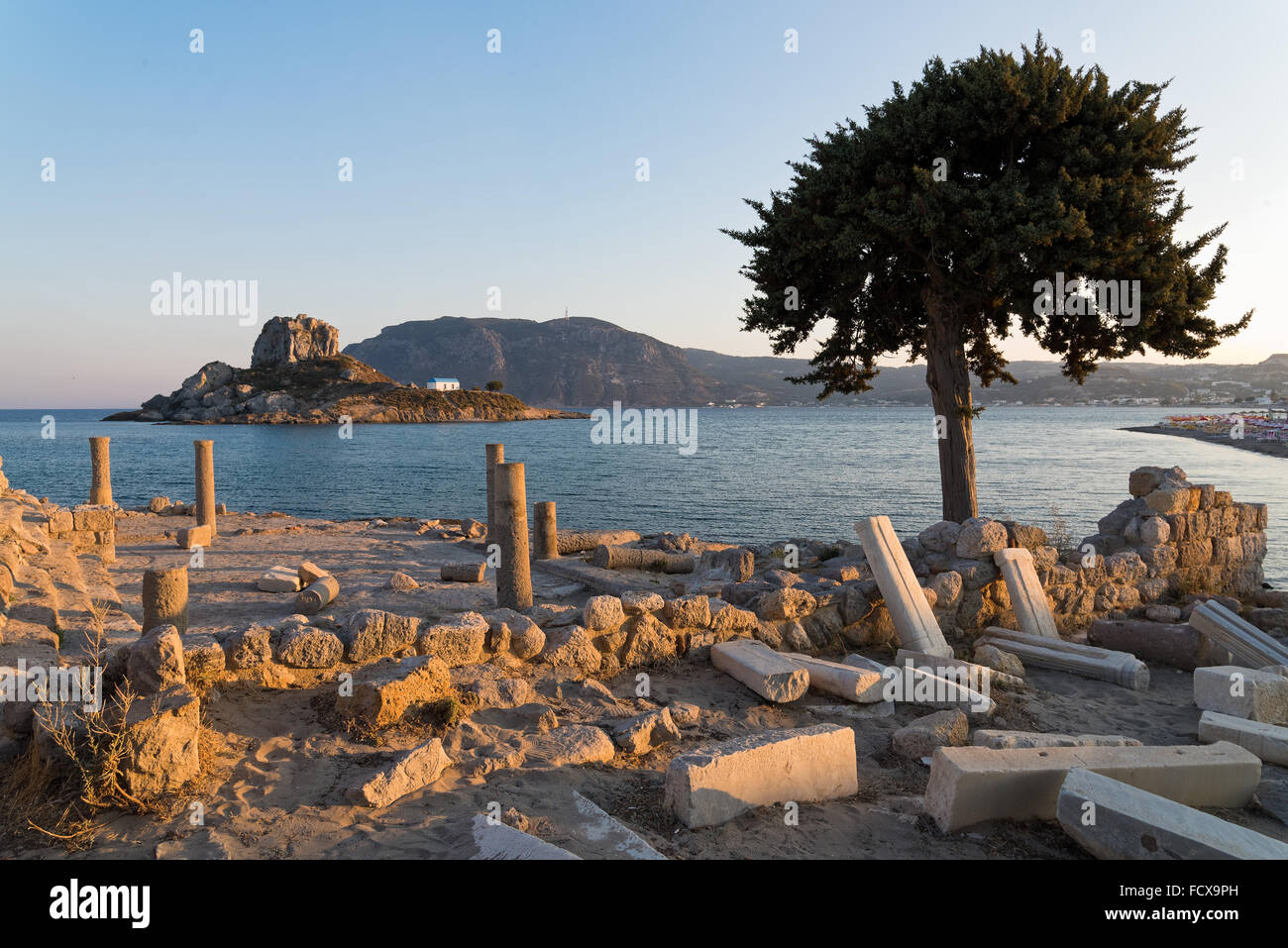 Landscape with archaeological site and islet at sunset in Kos island, Greece Stock Photo