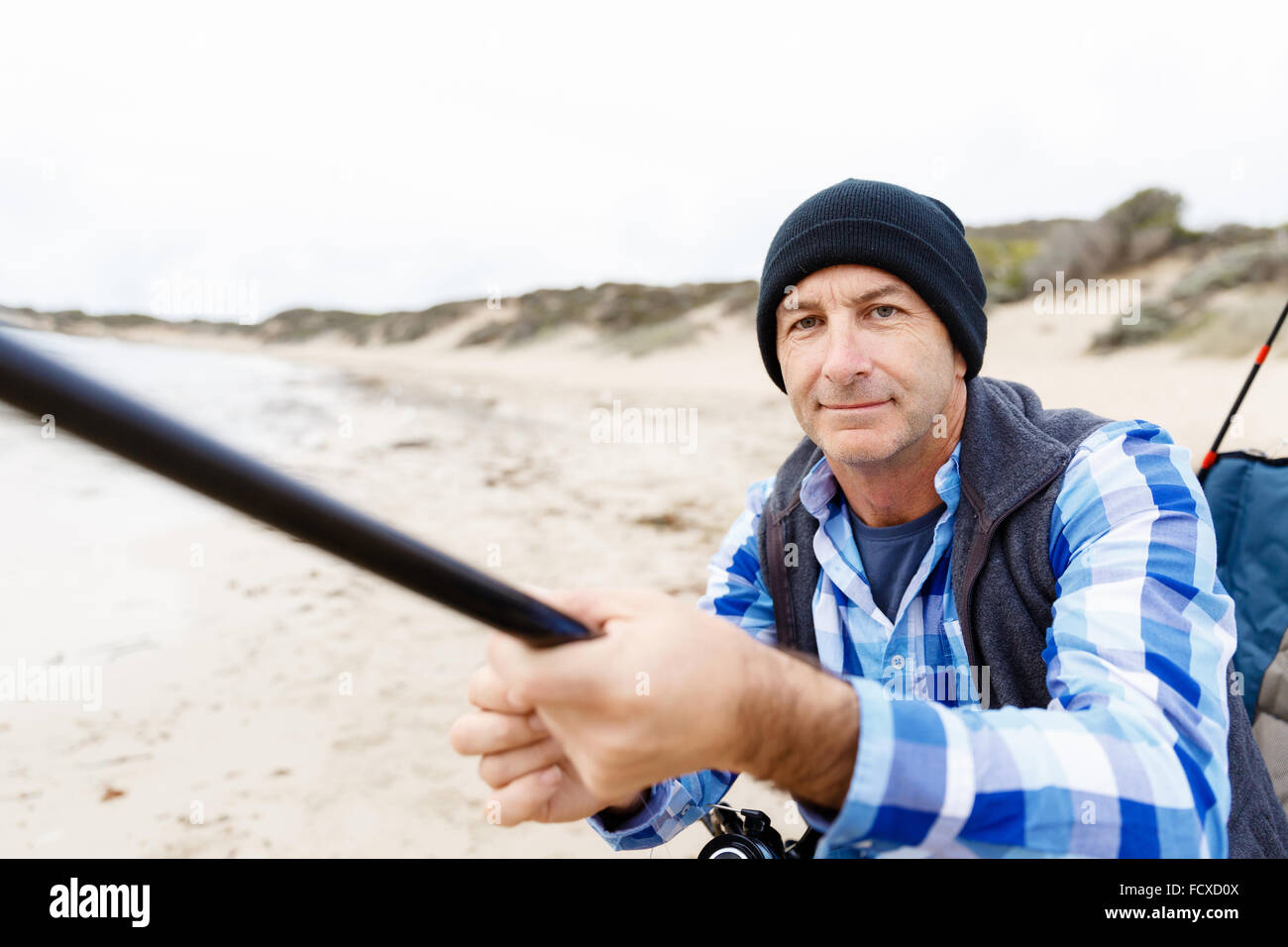 Picture of fisherman fishing with rods Stock Photo