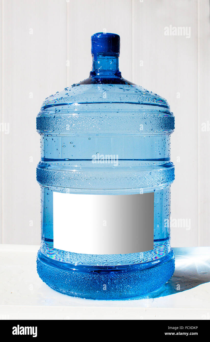 Big bottle of water with label on a white background Stock Photo - Alamy
