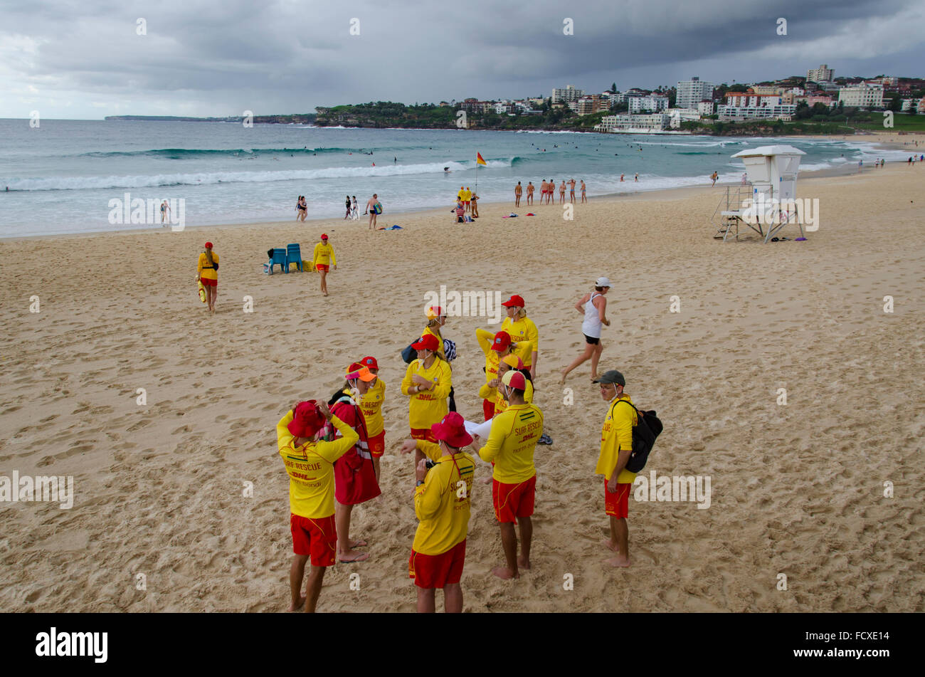 Bondi Beach, Sydney, Australia. 26th Jan, 2016: Australia Day and volunteer Surf Lifesavers sign on for duty at the northern end of Australia's most famous beach. Despite the overcast and stormy weather these Lifesavers can expect to be kept very busy managing and keeping safe the large crowds that will come to the beach on this national holiday. Credit:  Sydney Photographer/Alamy Live News Stock Photo