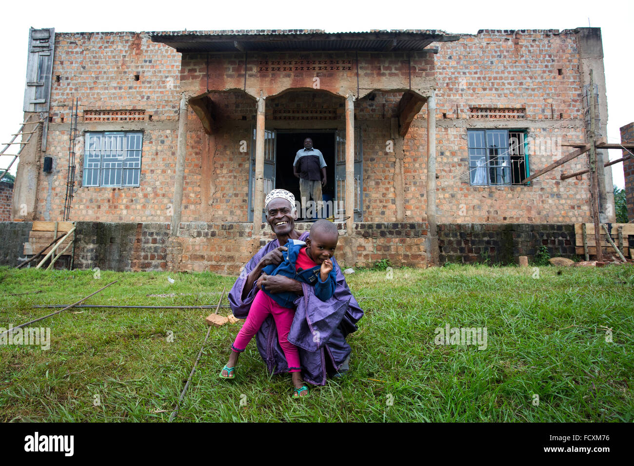 Hadji Twaha Matumbwe, one of the caretakers, and his granddaughter pose