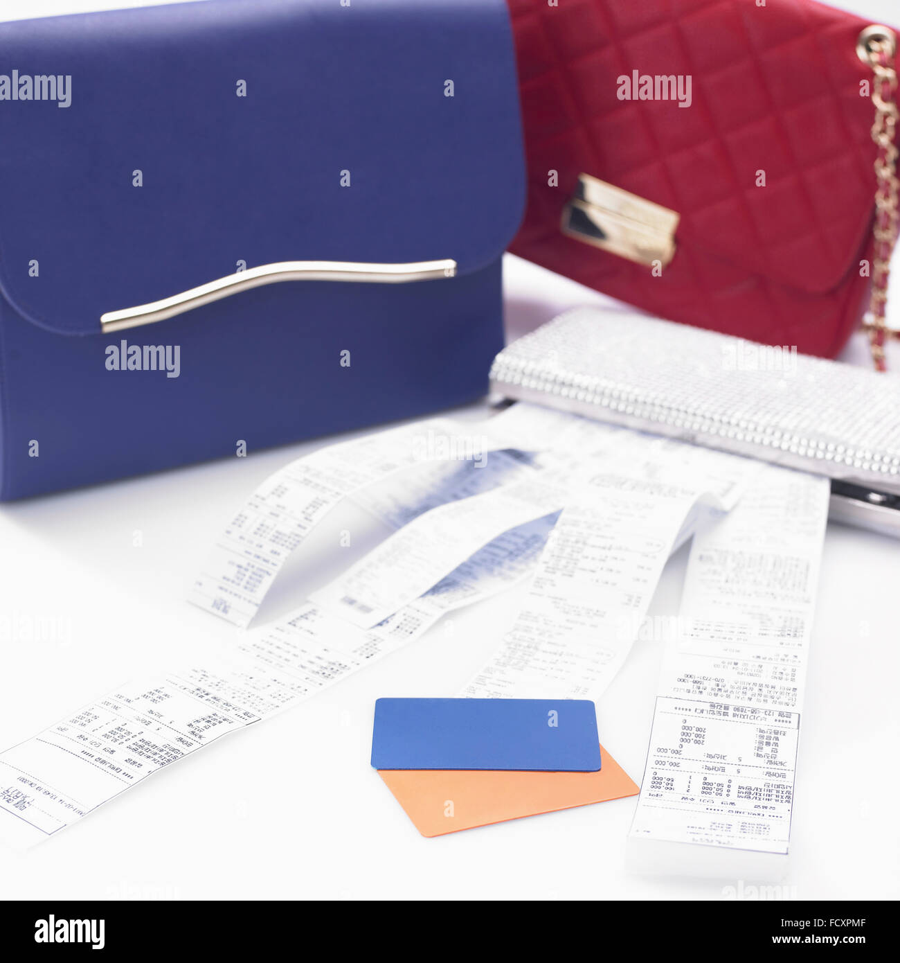 Credit cards and lots of receipts with bags Stock Photo