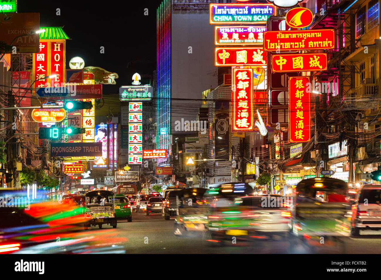 Yaowarat Road in Chinatown, neon signs at night, people and cars, commercial street, billboards, nightlife, Bangkok, Thailand Stock Photo