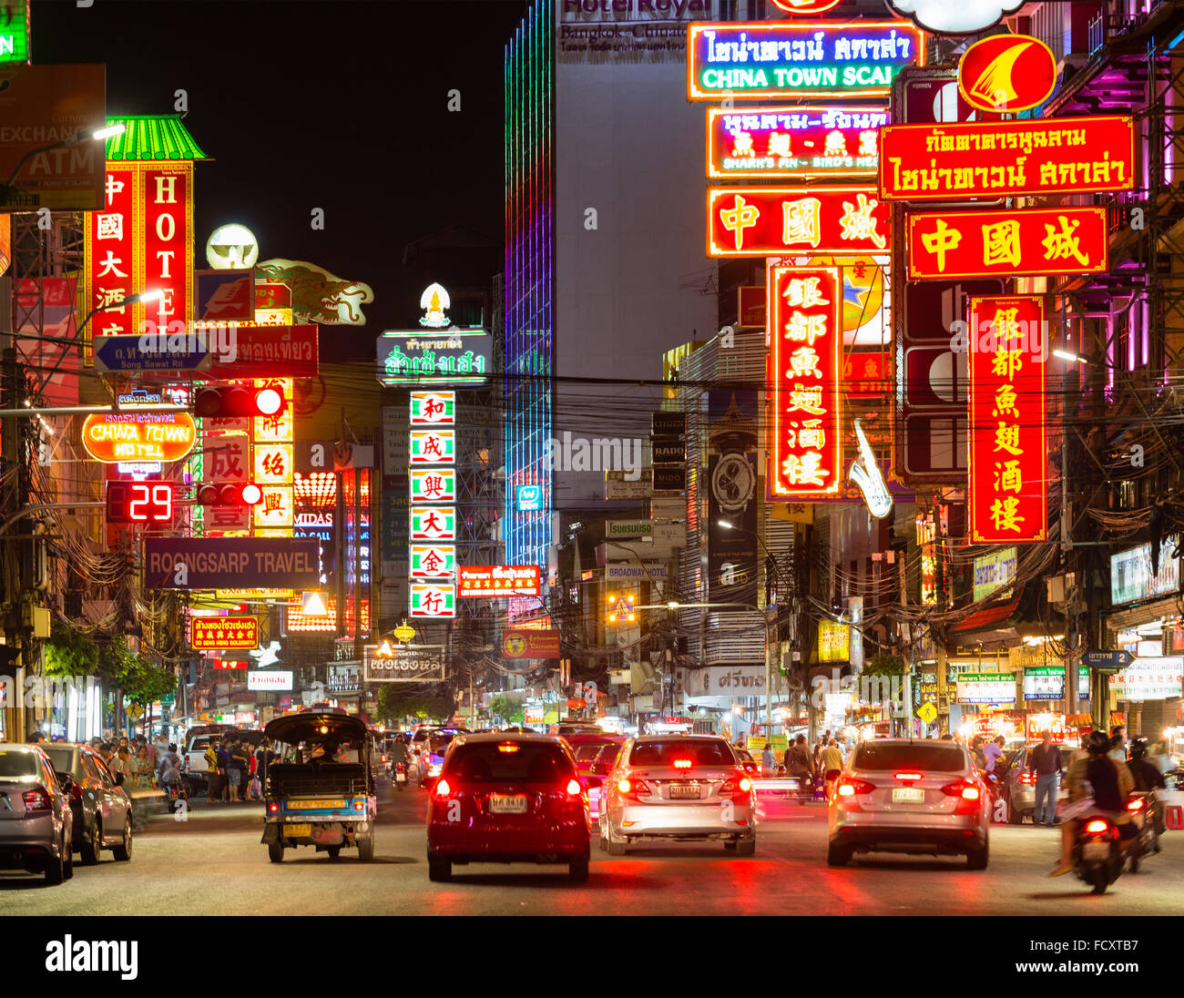 Yaowarat Road in Chinatown, neon signs at night, people and cars, commercial street, billboards, nightlife, Bangkok, Thailand Stock Photo