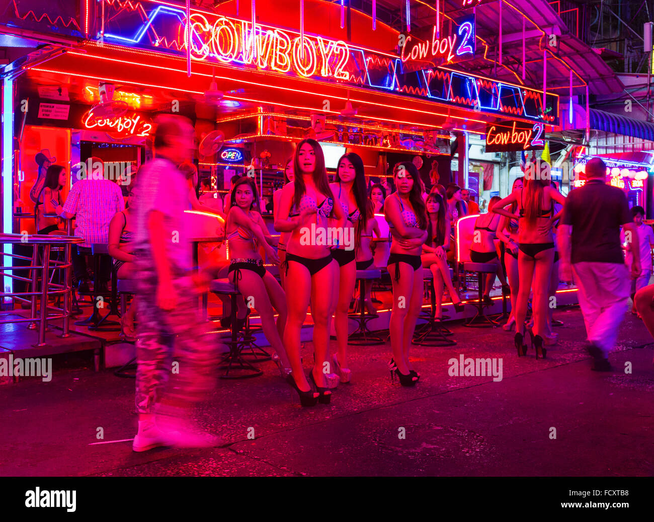 Nightlife, Soi Cowboy Red Light District, girls standing outside bar, Asoke Road, Sukhumvit, Bangkok, Thailand Stock Photo