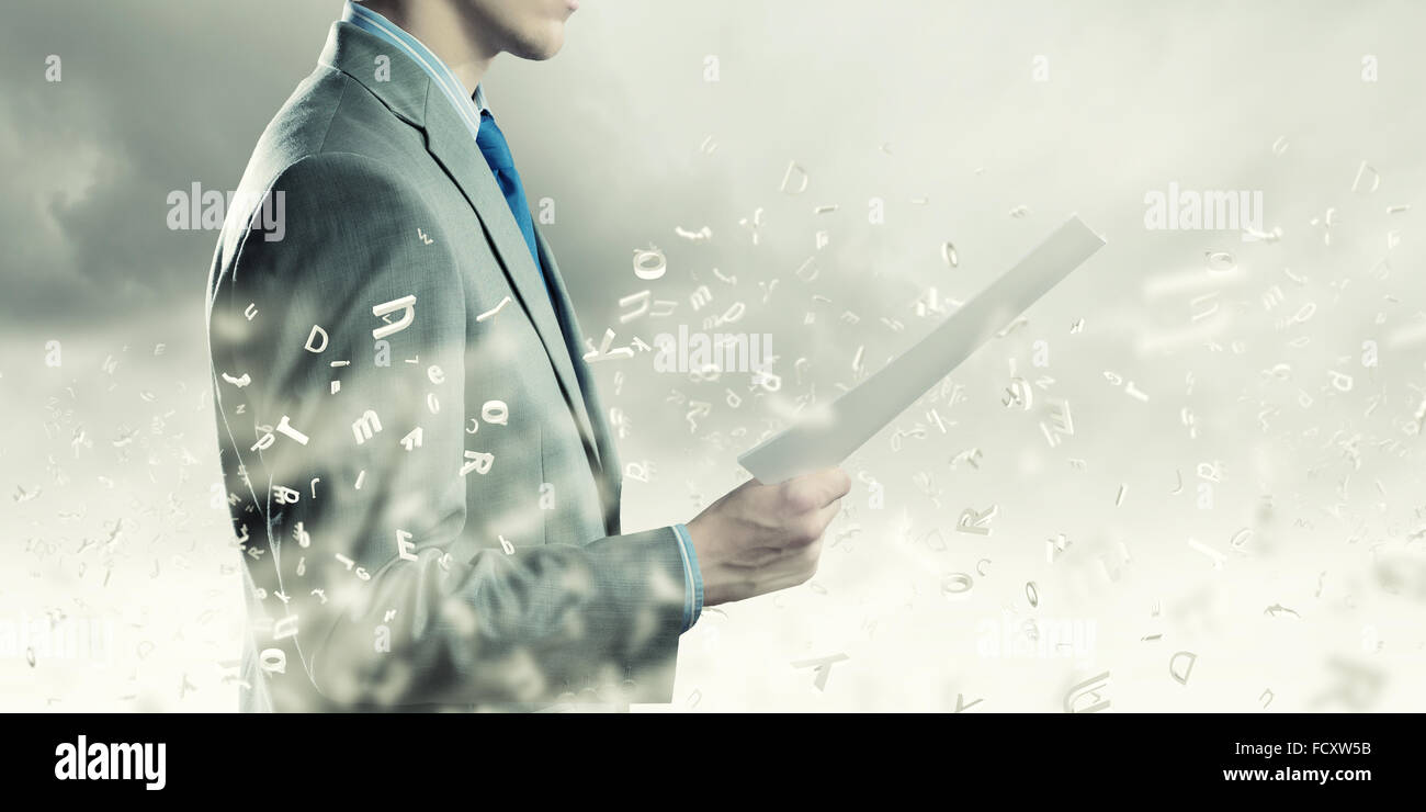 Back view of businessman reading documents in hand Stock Photo Alamy