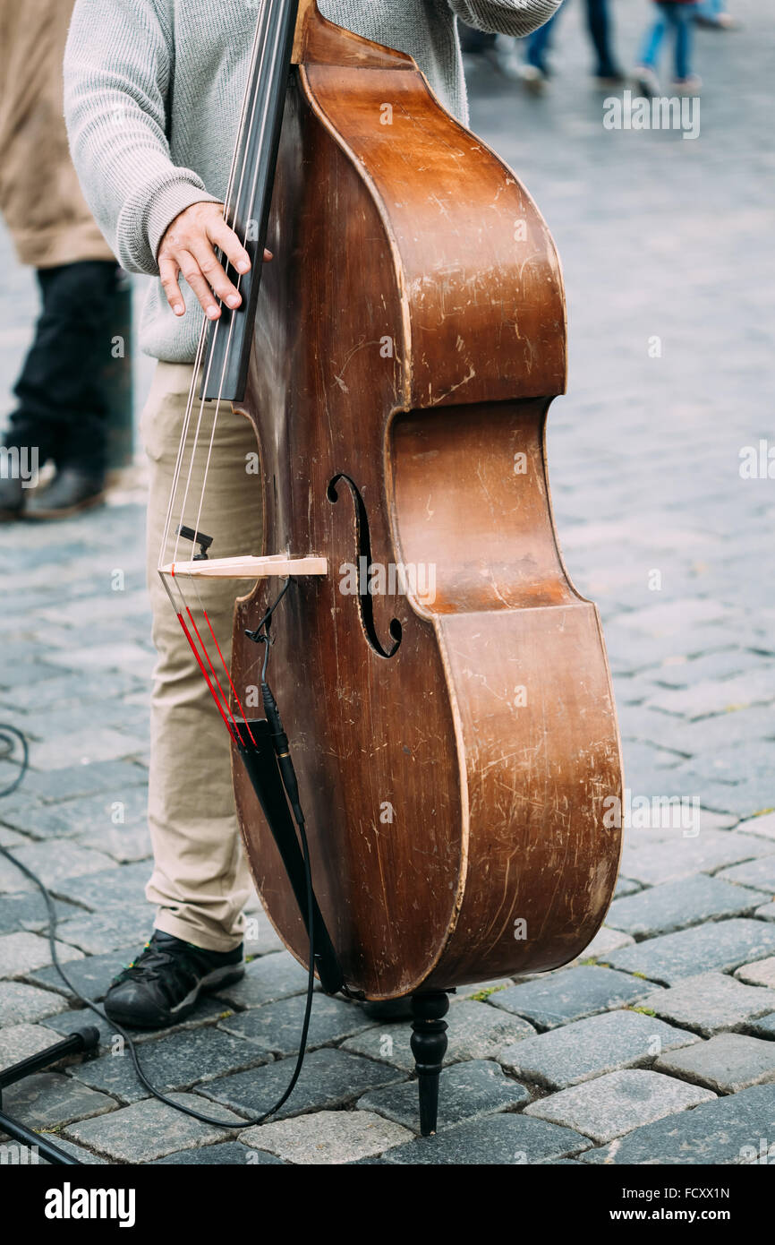 Street Busker performing jazz songs. Close up of contrabass Stock Photo