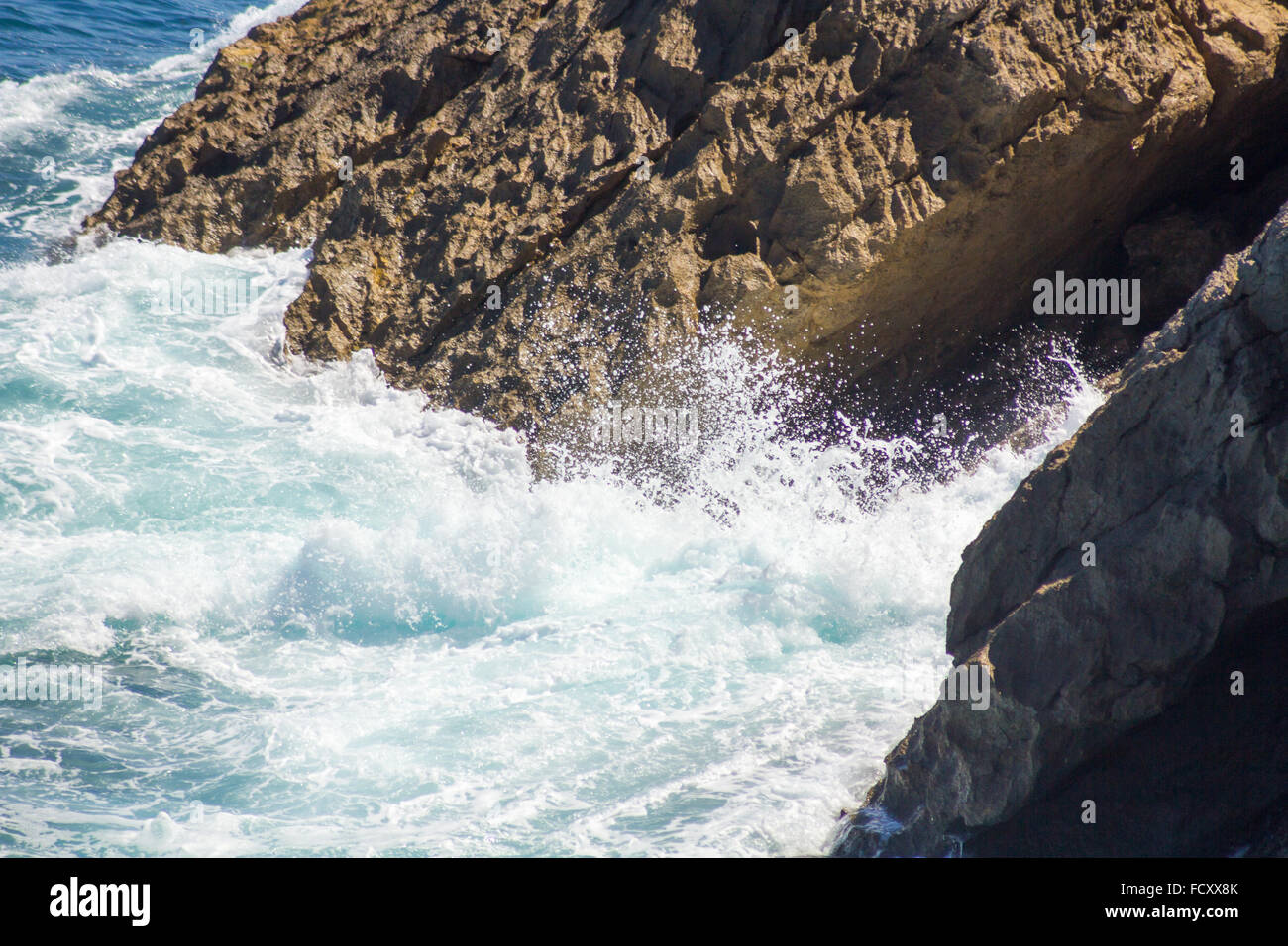 ocean waves crashing on the rocks with white foam Stock Photo - Alamy