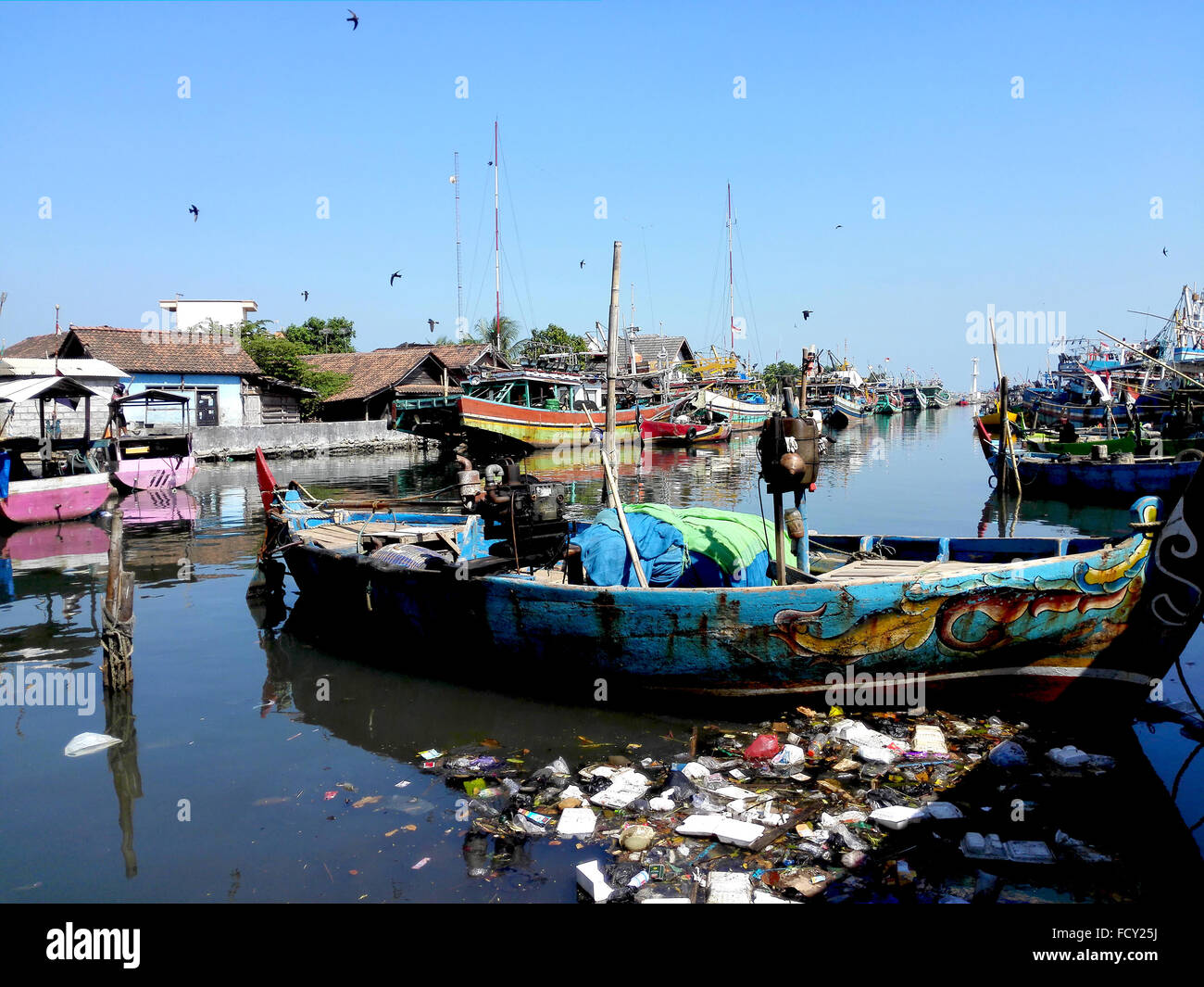 Java River Pollution Indonesia Central Java Jepara Fishing boats moored on the river, a good ...