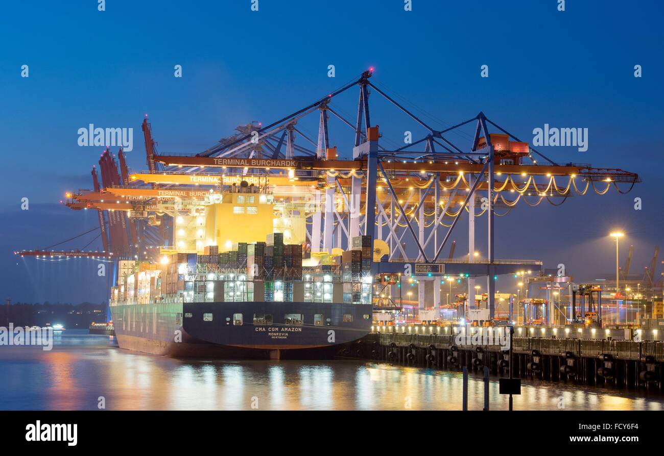 Cargo vessels are docked in the port of Hamburg, 20 January 2016 in Hamburg, Germany. Stock Photo