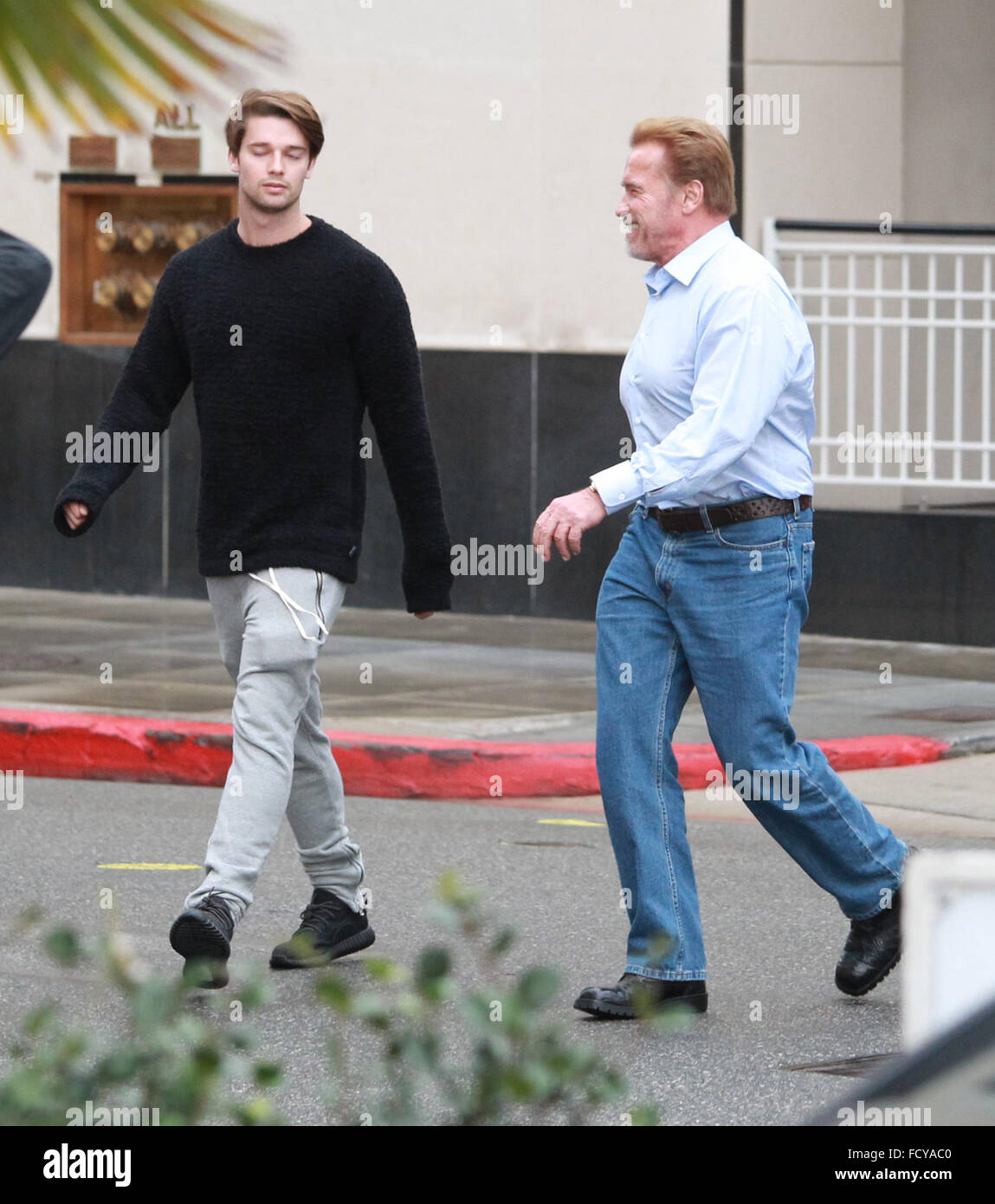 Arnold Schwarzenegger out shopping with his son Patrick Schwarzenegger at Barneys New York in Beverly Hills  Featuring: Arnold Schwarzenegger, Patrick Schwarzenegger Where: Los Angeles, California, United States When: 22 Dec 2015 Stock Photo