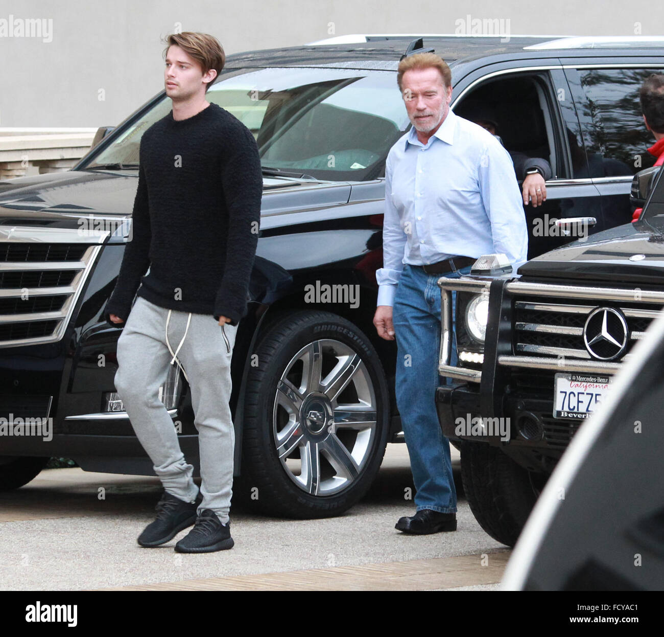 Arnold Schwarzenegger out shopping with his son Patrick Schwarzenegger at Barneys New York in Beverly Hills  Featuring: Arnold Schwarzenegger, Patrick Schwarzenegger Where: Los Angeles, California, United States When: 22 Dec 2015 Stock Photo