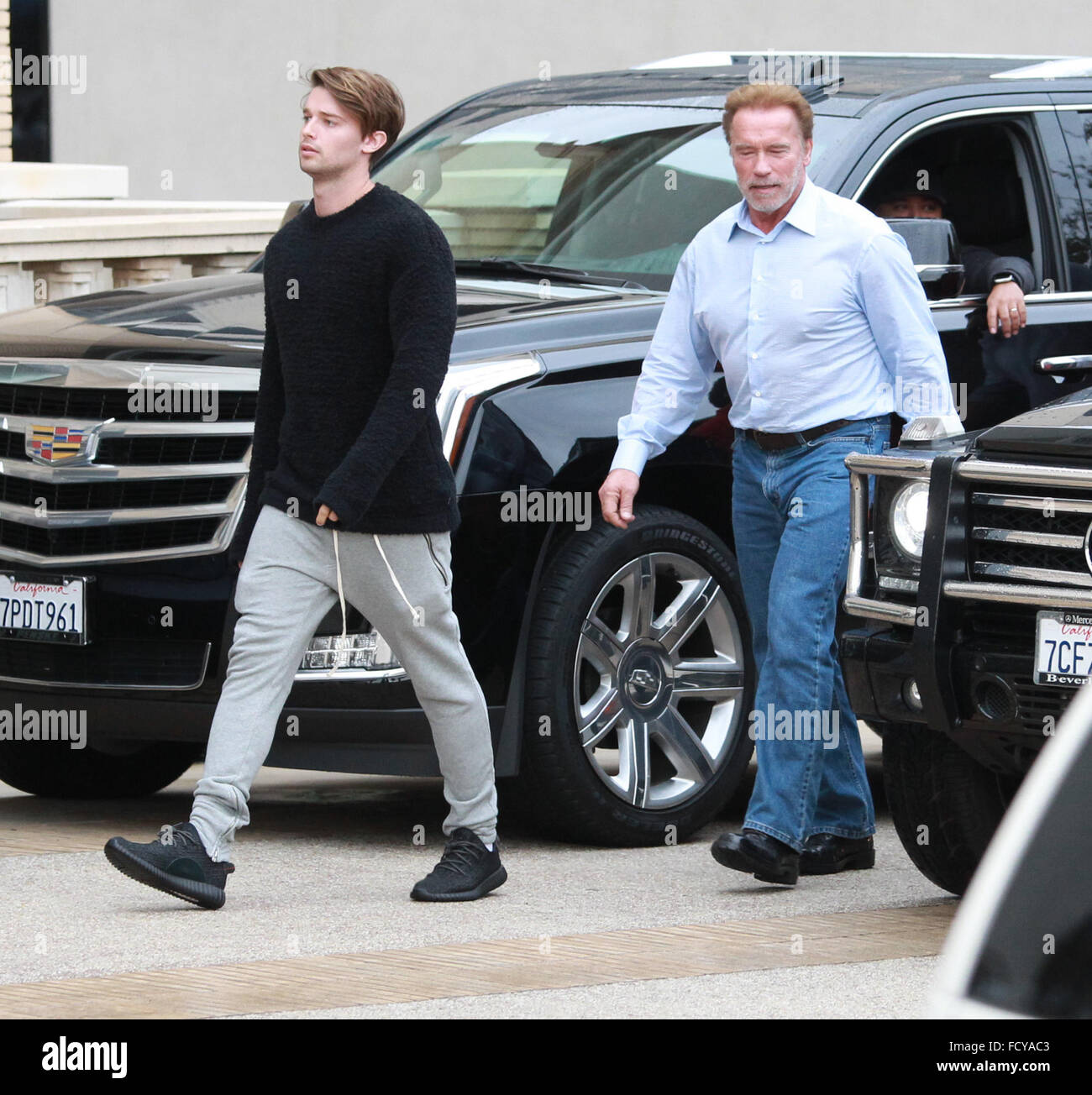 Arnold Schwarzenegger out shopping with his son Patrick Schwarzenegger at Barneys New York in Beverly Hills  Featuring: Arnold Schwarzenegger, Patrick Schwarzenegger Where: Los Angeles, California, United States When: 22 Dec 2015 Stock Photo