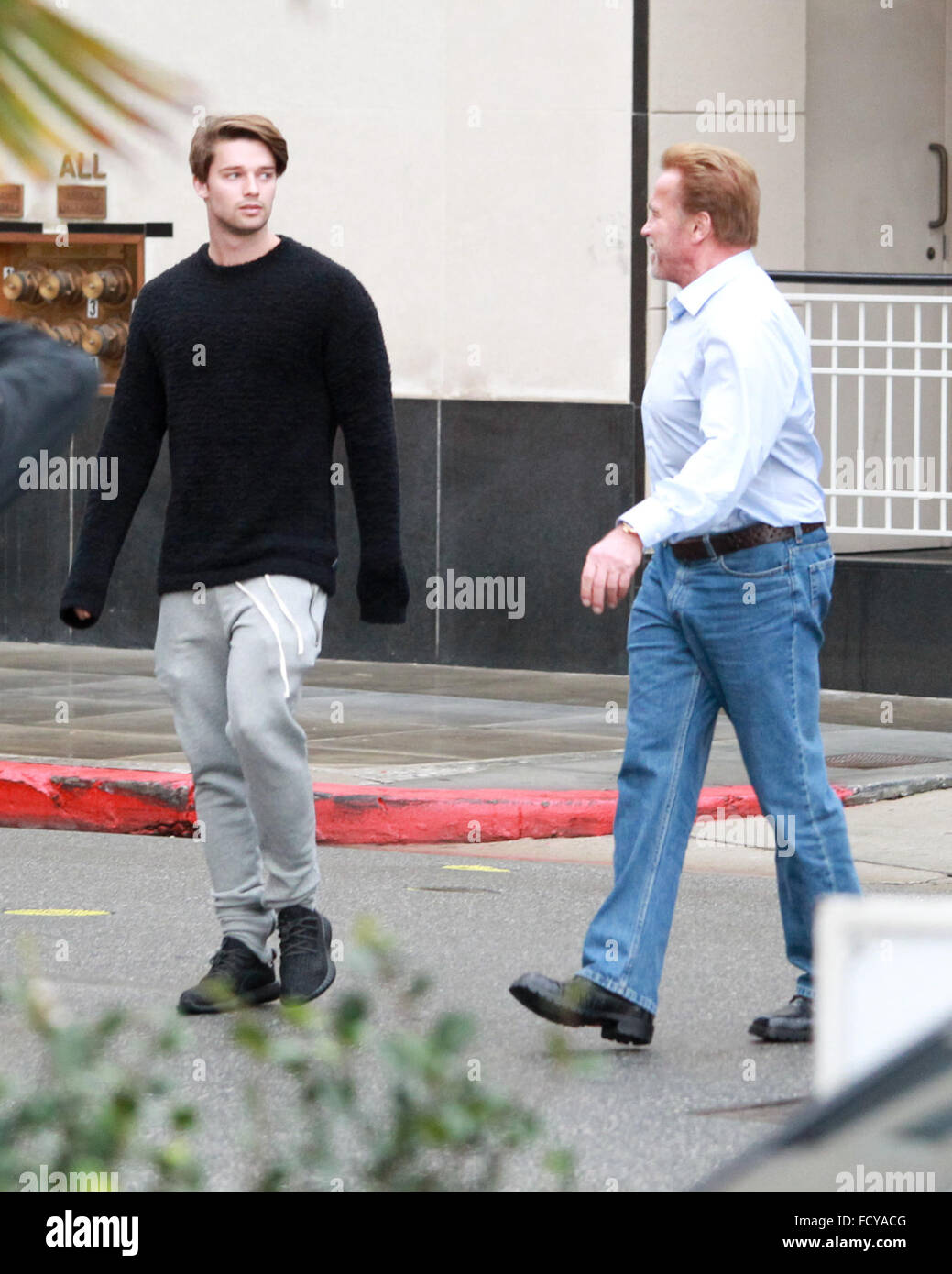Arnold Schwarzenegger out shopping with his son Patrick Schwarzenegger at Barneys New York in Beverly Hills  Featuring: Arnold Schwarzenegger, Patrick Schwarzenegger Where: Los Angeles, California, United States When: 22 Dec 2015 Stock Photo