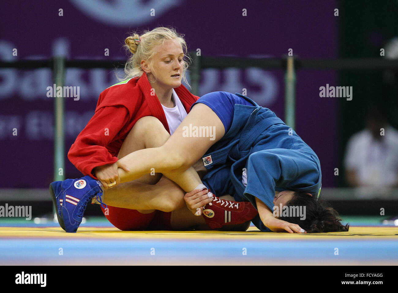 Olena Sayko (UKR, red) vs Tatsiana Matsko (BLR, blue). Final. Women's 64kg. Sambo. Heydar Aliyev Arena. Baku2015. 1st European Games. Baku. Azerbaijan. 22/06/2015 Stock Photo