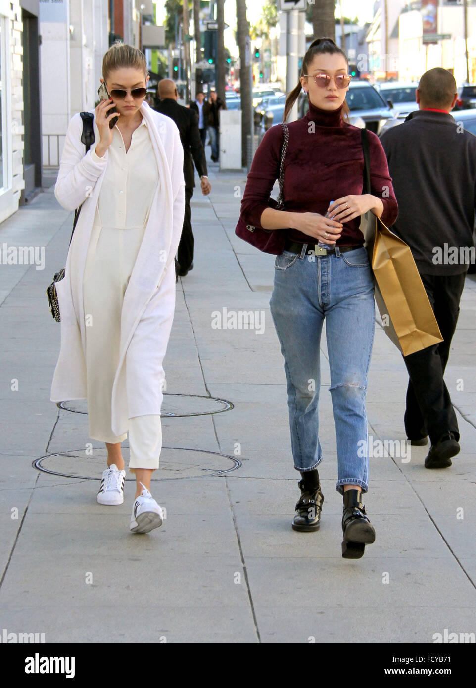 Sisters Bella and Gigi Hadid go clothes shopping at Yves Saint