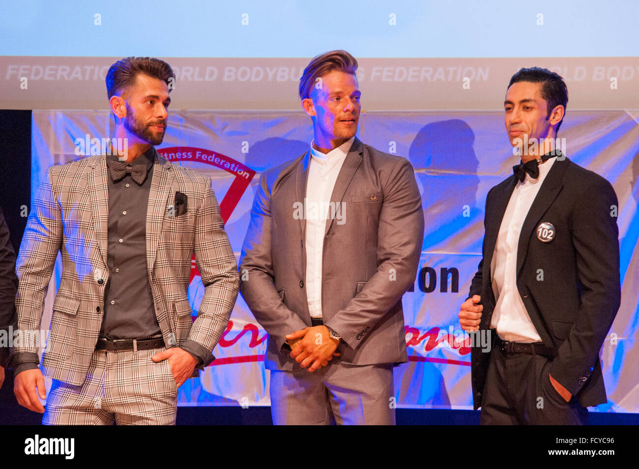 MAASTRICHT, THE NETHERLANDS - OCTOBER 25, 2015: Male fitness models Ali Dalili from Iran, Maxime Maurissen and Joy Flex dressed  Stock Photo