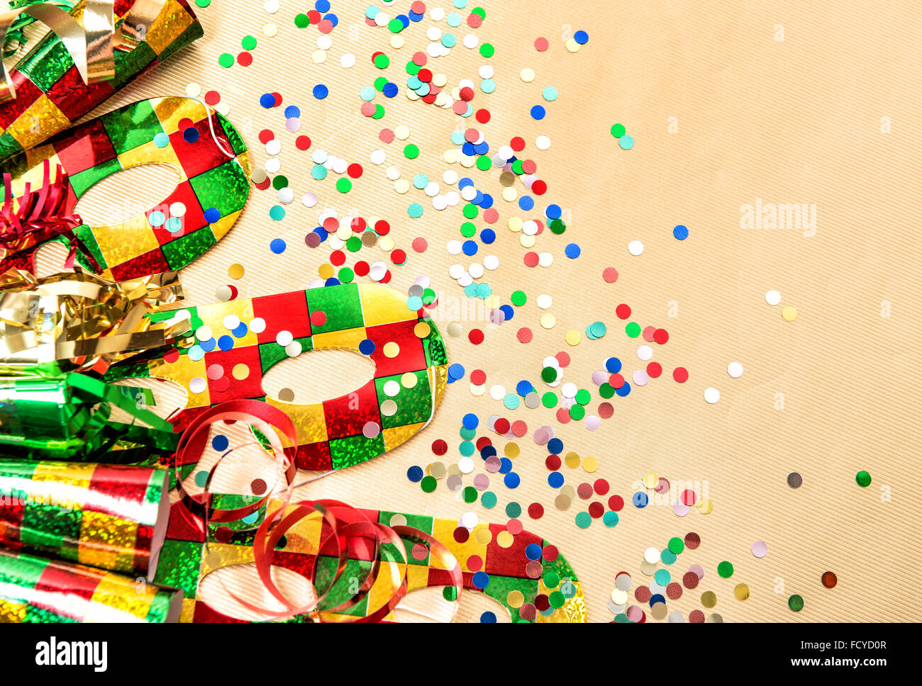 Carnival party mask, confetti and streamer decoration. Colorful holidays background Stock Photo
