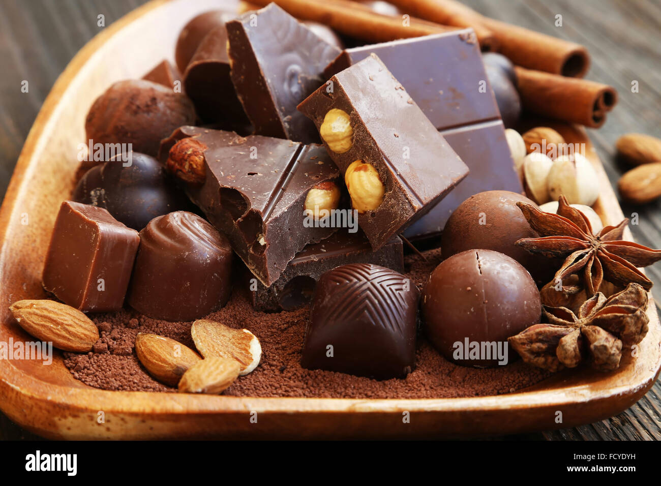 Chocolate pralines and tablet with cocoa,nuts and anise Stock Photo
