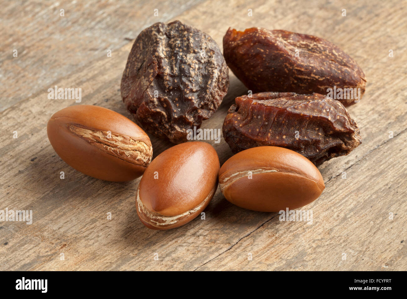 Whole moroccan argan nuts and nutshells Stock Photo