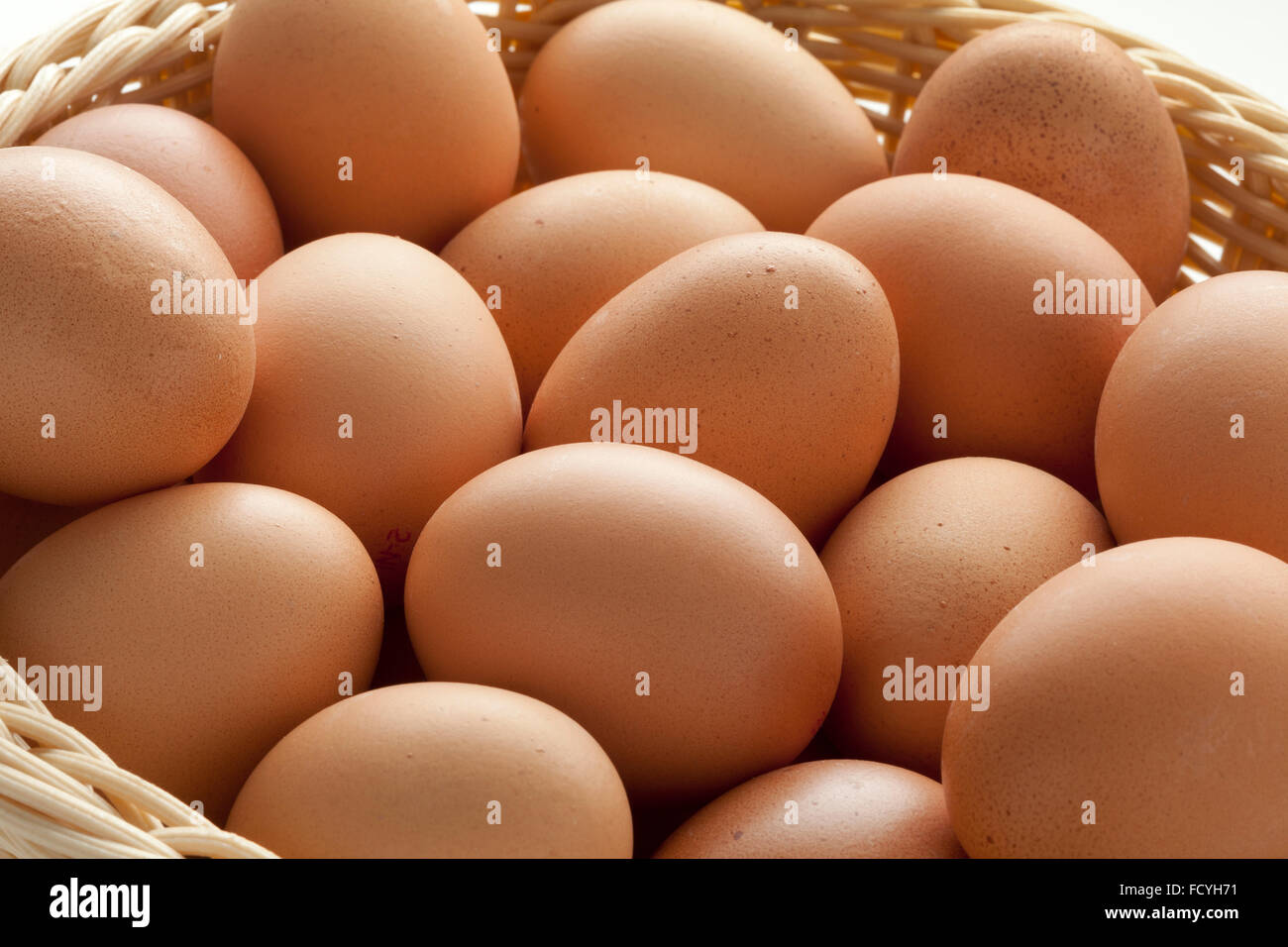 Basket with fresh brown eggs close up Stock Photo